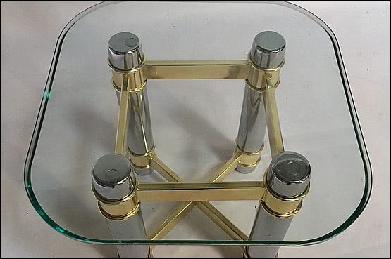 ☑️ 20th Century Decorative Arts |A side table, the glass top supported on a brass and chrome plated metal base