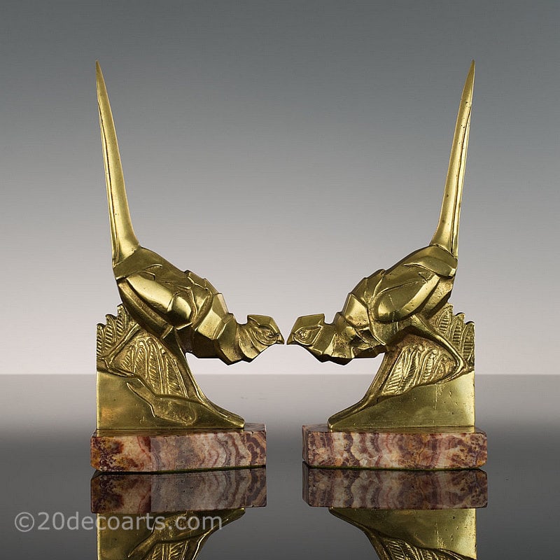  Irénée Rochard - A pair of Art Deco Bookends, France circa 1930, the polished bronze cubist style pheasants mounted on a rouge marble bases