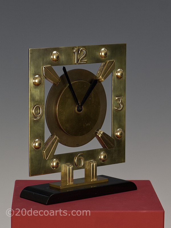 Modernist Art Deco Clock by Bayard, France circa 1930, made of bronze and brass, mounted on black marble.