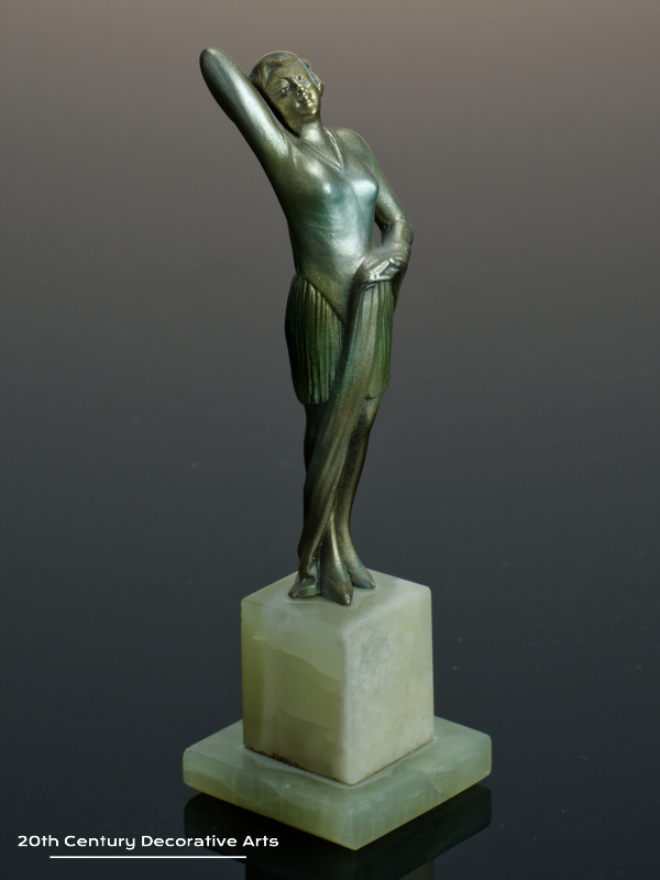  20th Century Decorative Arts |An exquisite Art Deco Austrian bronze figure by Josef Lorenzl, circa 1930 "Fashion" depicting a stylish modern woman, with a silver, gold and enamelled cold-painted finish, mounted on a green onyx base