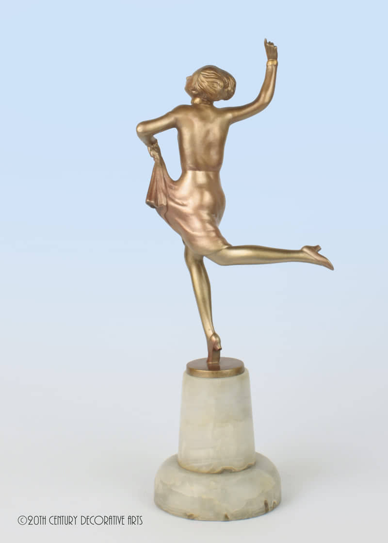  20th Century Decorative Arts |A pretty Art Deco Austrian bronze figure by Josef Lorenzl "Dancer", circa 1930s depicting a dancer with a silver lacquered and enamelled finish, mounted on an unusual grey onyx base 