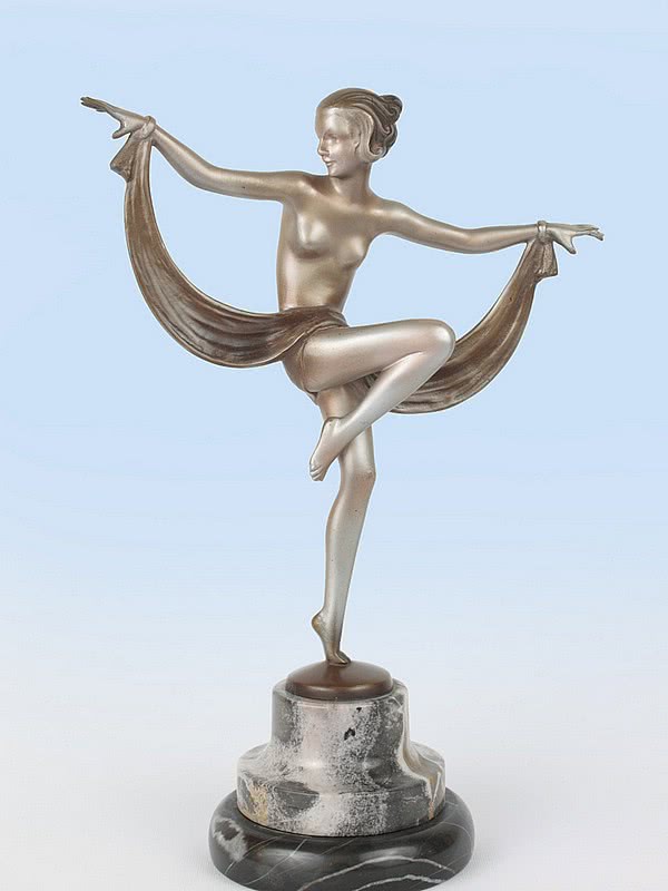  20th Century Decorative Arts |An exquisite Art Deco Austrian bronze figure by Josef Lorenzl, circa 1930 depicting a dancing woman with drape, with cold-painted silver finish, mounted on a shaped marble base