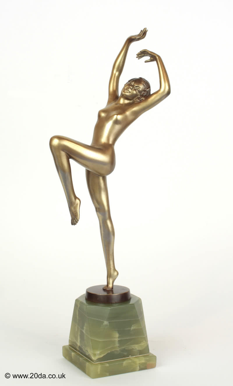  20th Century Decorative Arts |A delightful Art Deco Austrian bronze figure by Josef Lorenzl, circa 1930  depicting a stylish young dancer, with silver lacquer cold-painted finish, mounted on a green onyx base