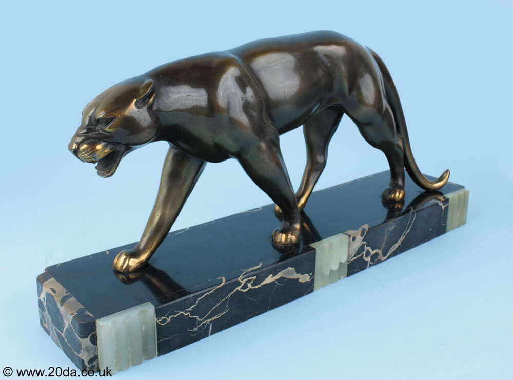  20th Century Decorative Arts |Ruchot - An Art Deco metal patinated panther sculpture, France circa 1930, mounted on a marble and onyx base.